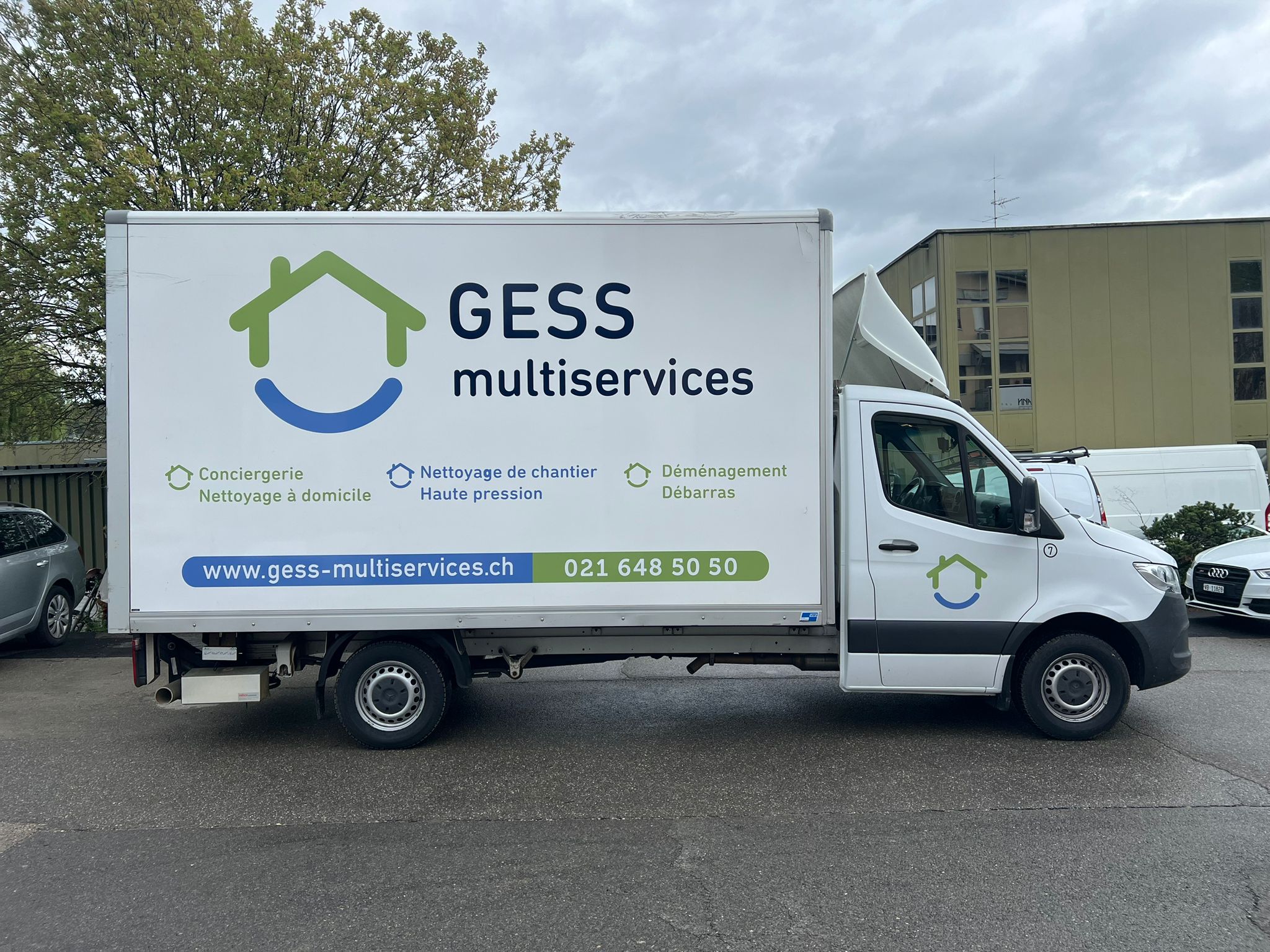 a white truck with a logo on it