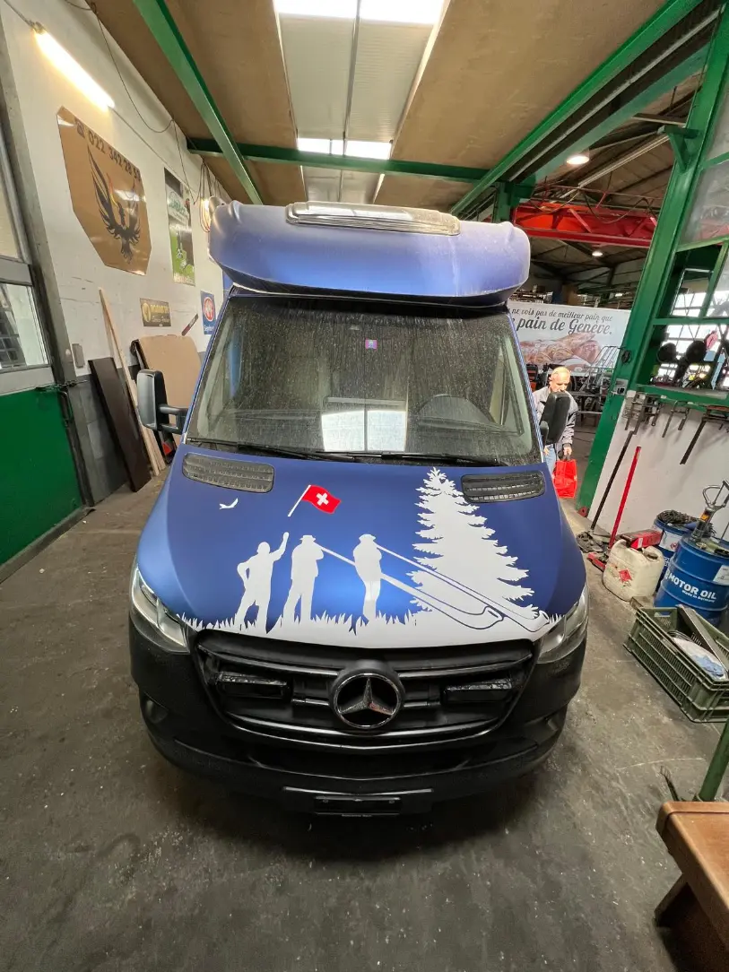 a blue van with a white design on it