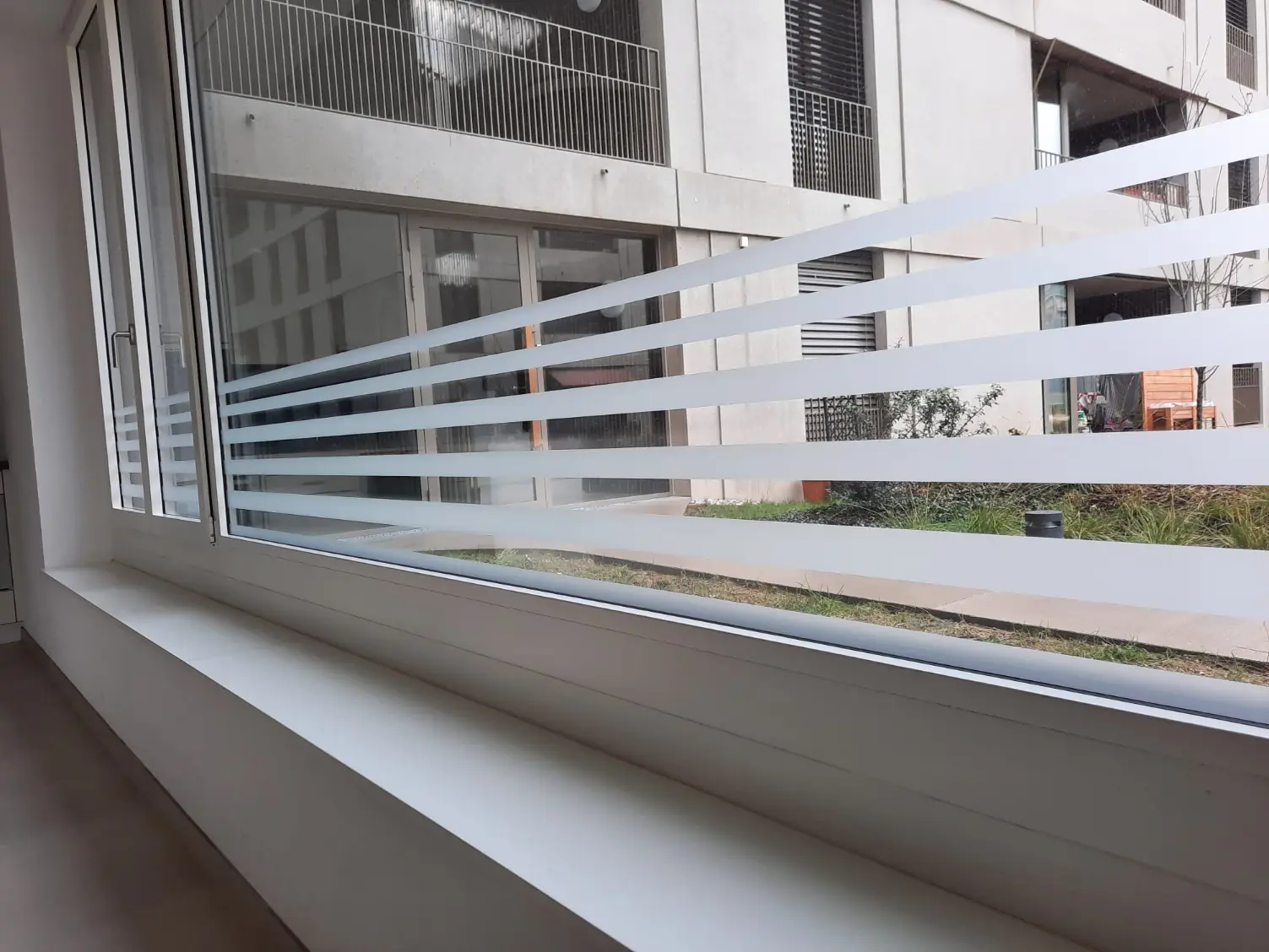 a window with white stripes