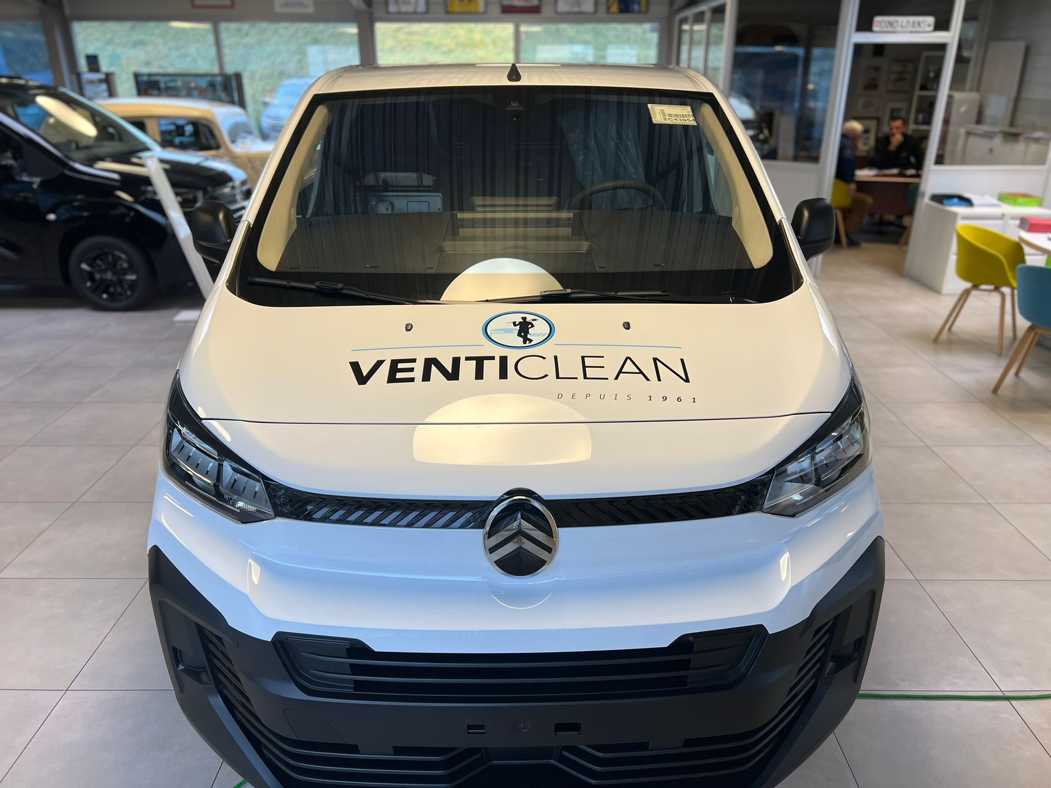 a white car in a showroom