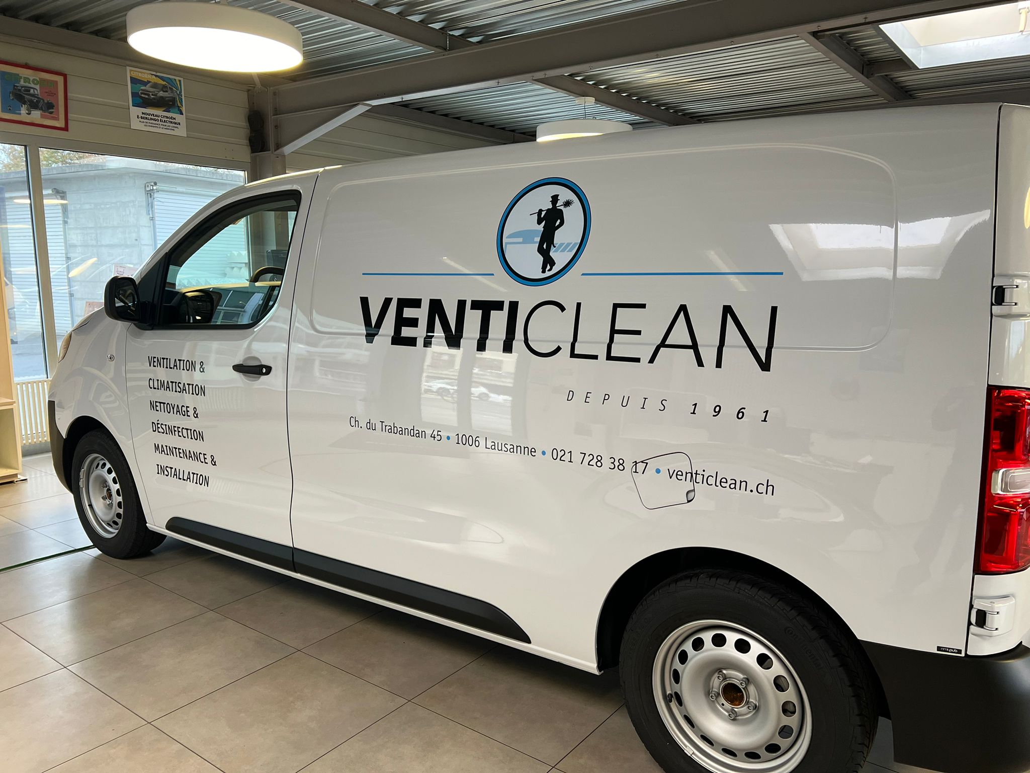 a white van with black text on it