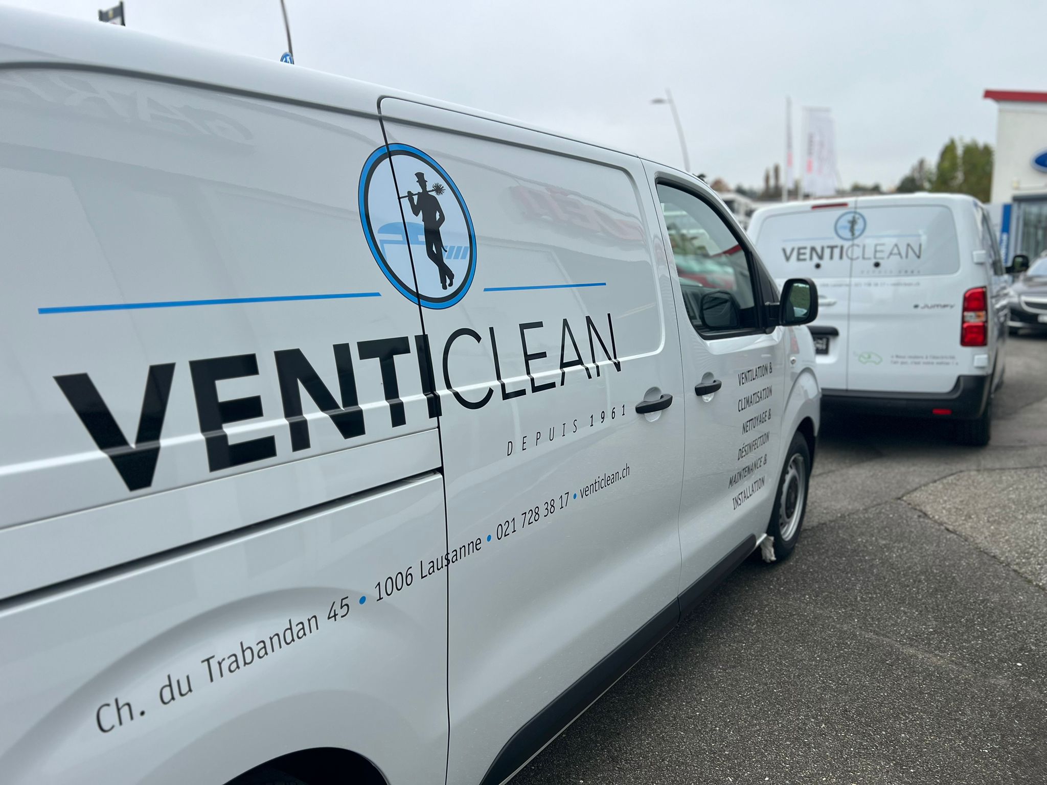 a white van with black text on it