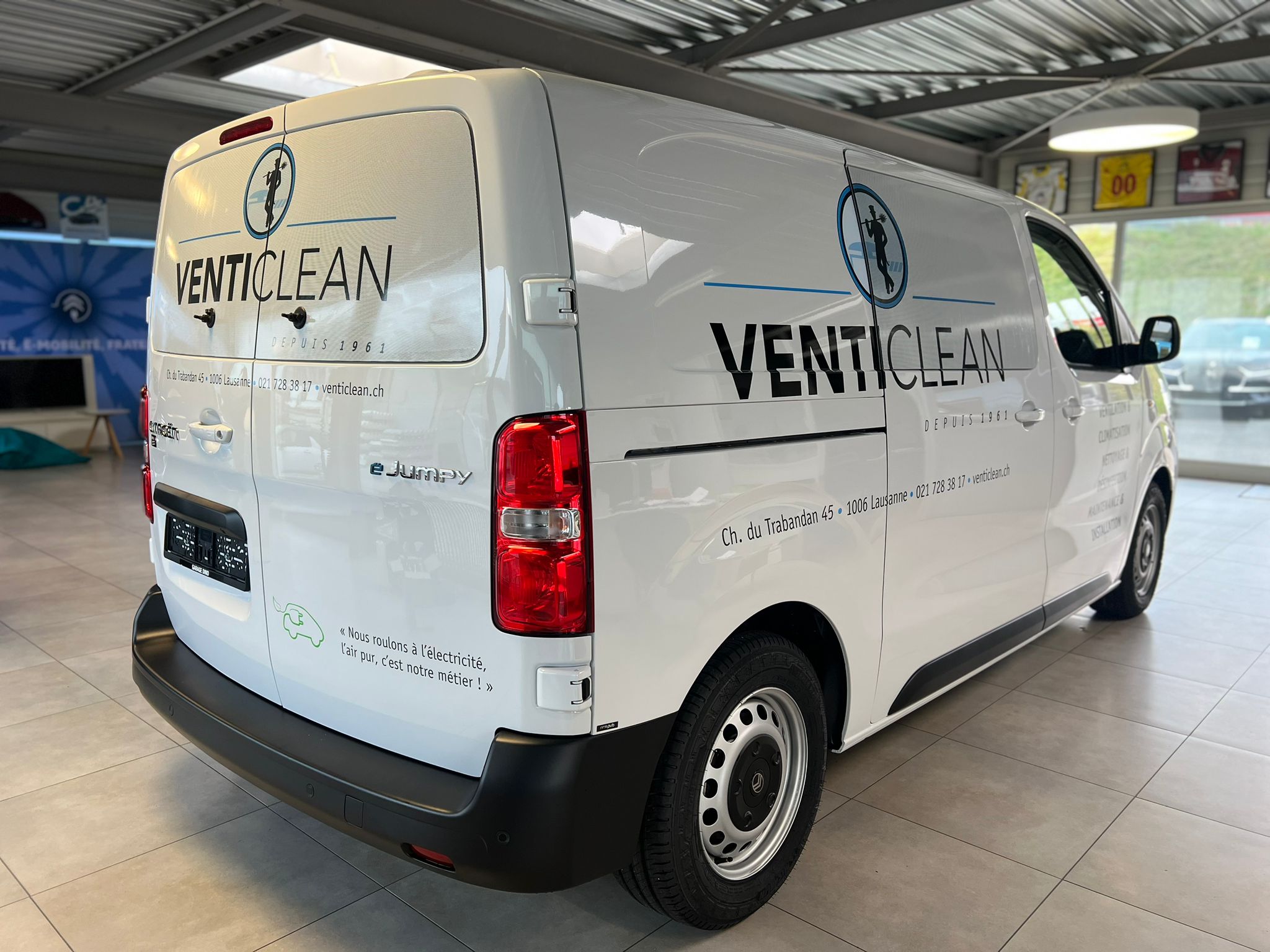 a white van with black text on it