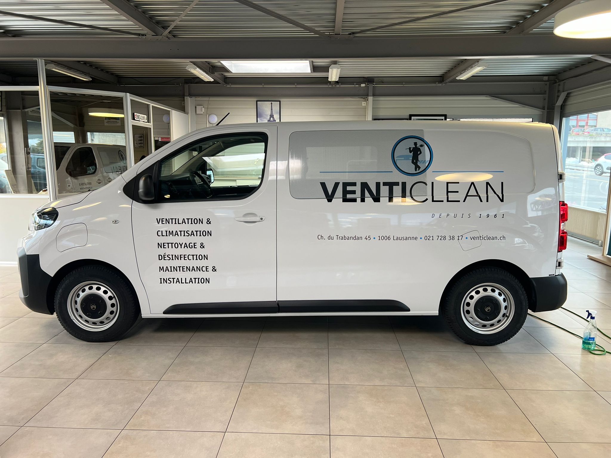 a white van with black text on it