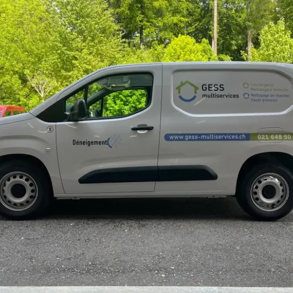 vehicle-covering-client-gess-b-1 a white van parked on the side of a road