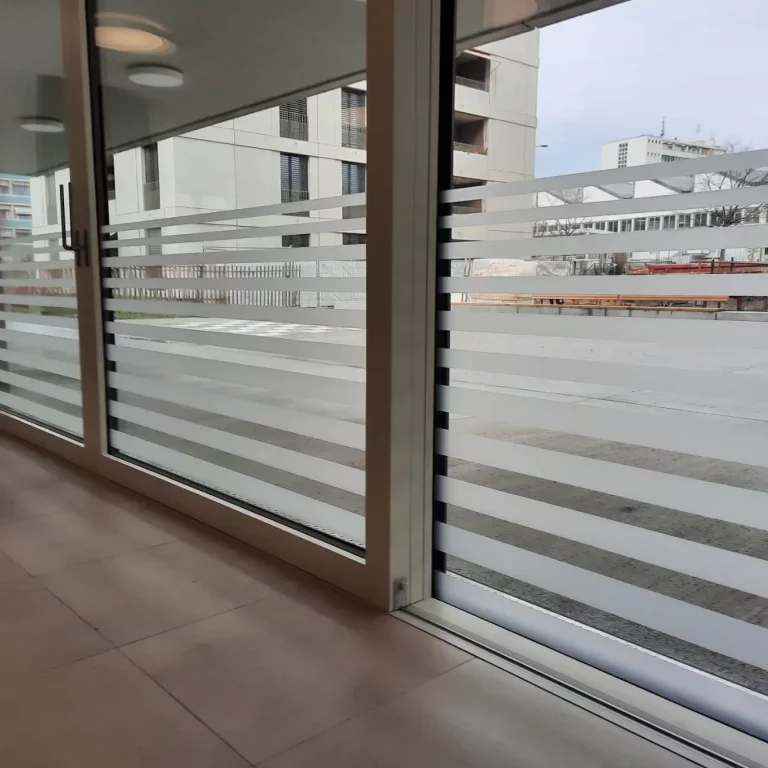 a glass wall with a window